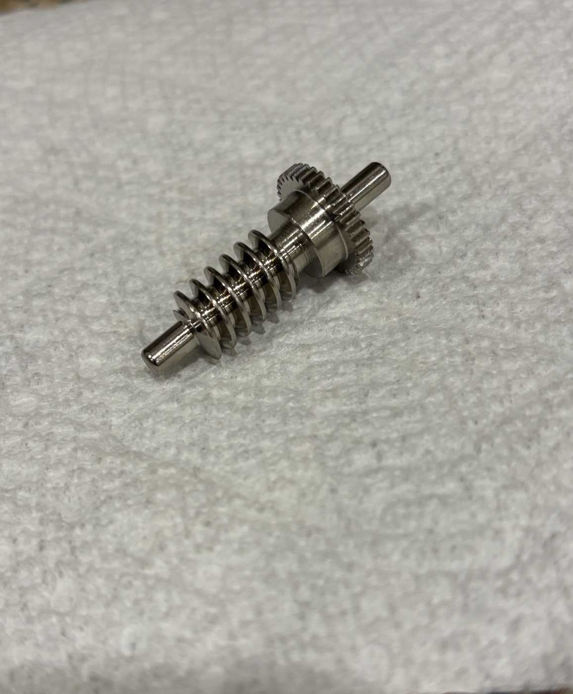 Redesigned metal spur gear on the worm gear shaft, ready for installation